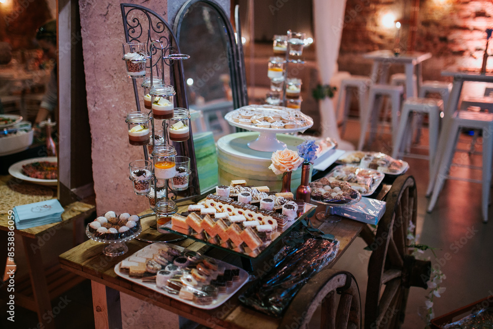 An assortment of beautifully arranged desserts, featuring vibrant fruits and delicate garnishes, perfect for a wedding celebration An assortment of beautifully arranged desserts, featuring vibrant fruits and delicate garnishes, perfect for a wedding celebration