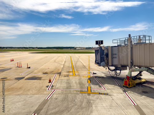 Apron of airport with jetway viewed from the passenger terminal photo