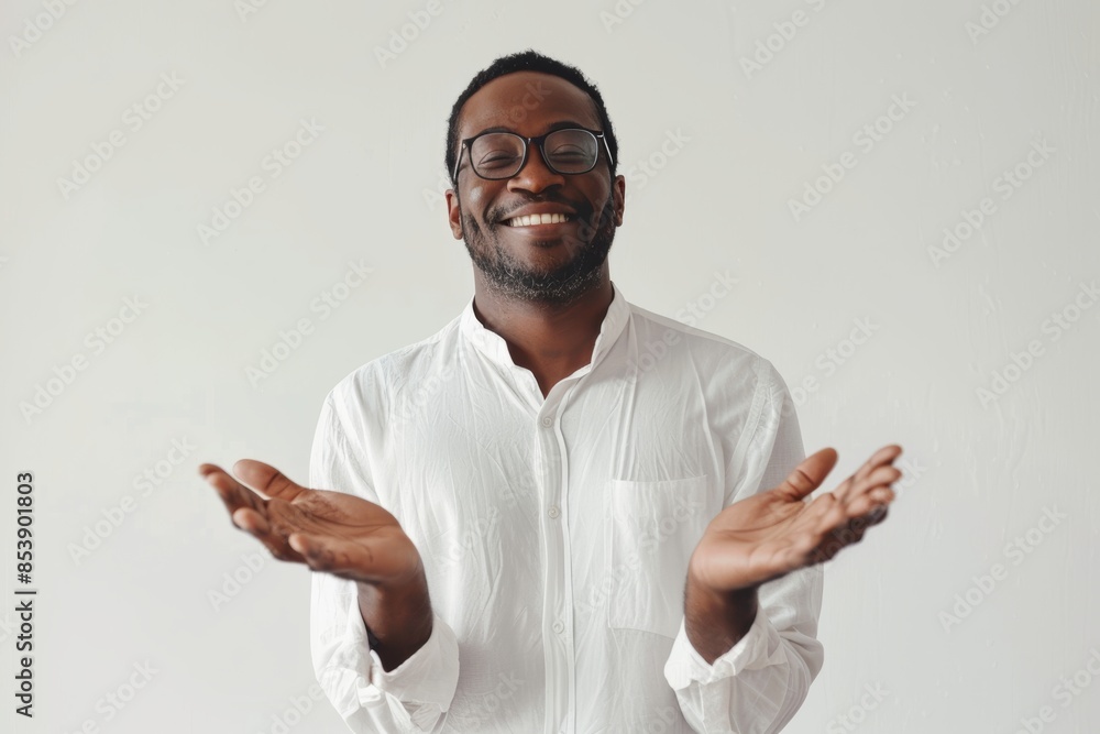 Portrait of a happy man in his 30s joining palms in a gesture of gratitude isolated on white background Portrait of a happy man in his 30s joining palms in a gesture of gratitude isolated on white background