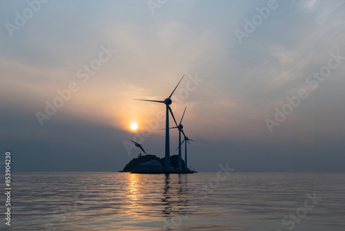 View of the wind turbines and flying seagulls during sunset on the sea photo
