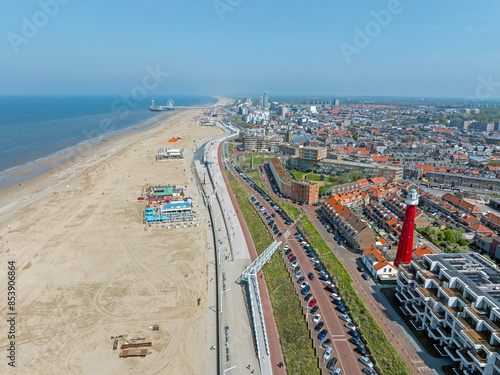 Aerial from Scheveningen with the lighthouse at the North Sea in the Netherlands