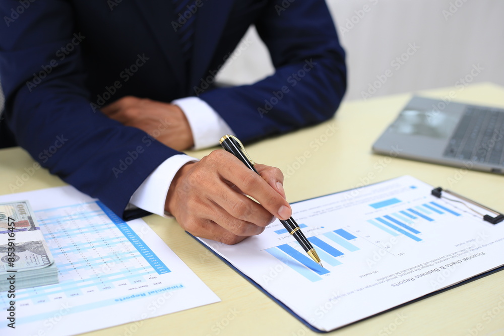 Looking at busy businessman's hands Using smartphones and laptops in the office, AI creates images. Looking at busy businessman's hands Using smartphones and laptops in the office, AI creates images.