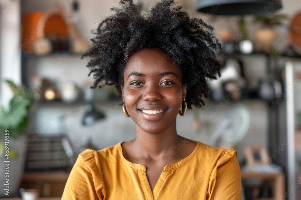 Portrait of a blissful afro-american woman in her 30s smiling at the camera in front of modern minimalist interior Portrait of a blissful afro-american woman in her 30s smiling at the camera in front of modern minimalist interior
