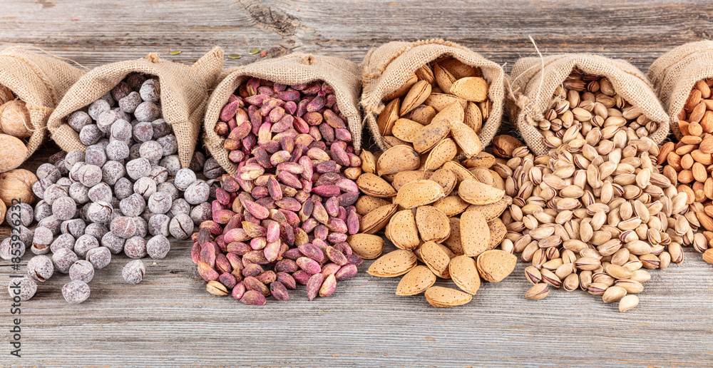 Assorted nuts and seeds background. mixed raw food for snacking, top ...