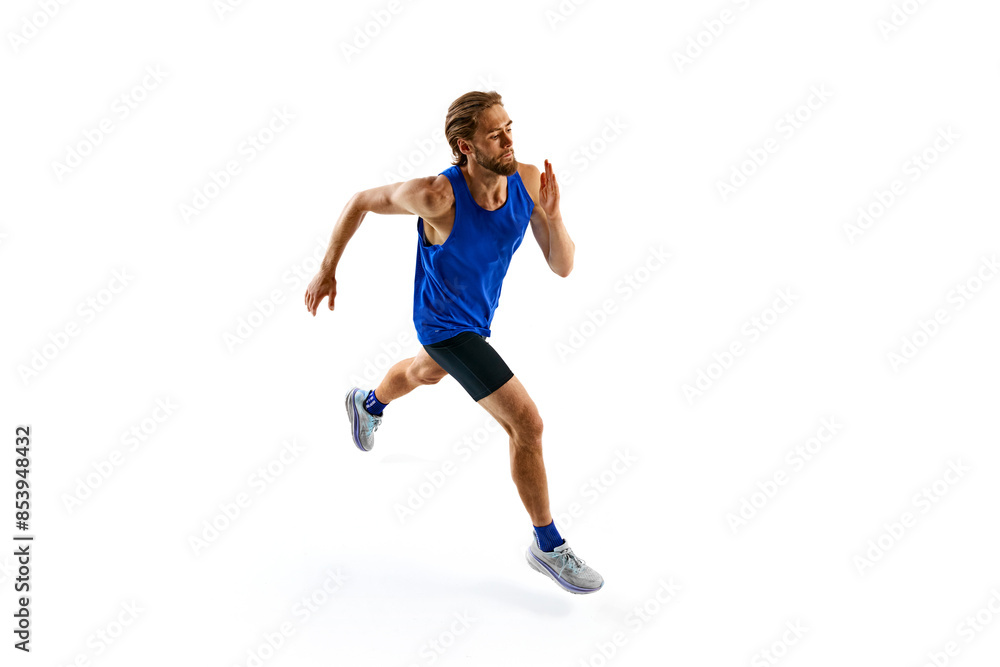 Energetic and motivated man, runner in motion in blue uniform, training, running isolated on white studio background. Concept of sport, marathon, competition, healthy and active lifestyle Energetic and motivated man, runner in motion in blue uniform, training, running isolated on white studio background. Concept of sport, marathon, competition, healthy and active lifestyle