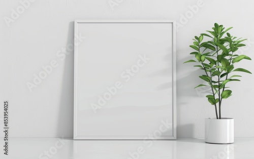 Wallpaper Mural Minimalistic blank frame with a potted plant on the side, perfect for artwork display or mockups in a modern interior setting. Torontodigital.ca