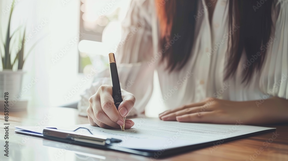 Businesswoman Signing Document with Pen, Authorizing Rights and Finalizing Important Agreement. Legal and Professional Authorization Concept Businesswoman Signing Document with Pen, Authorizing Rights and Finalizing Important Agreement. Legal and Professional Authorization Concept
