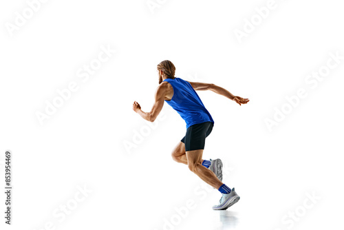 Dynamic image of man in a run, runner in motion, training isolated on white studio background. Speed and endurance. Concept of sport, marathon, competition, healthy and active lifestyle