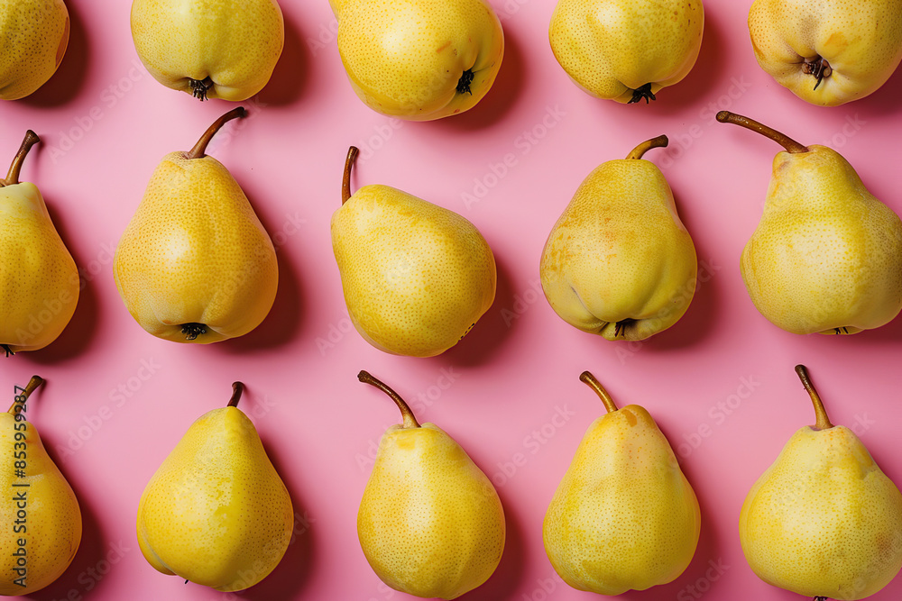 Colorful pattern of yellow pears on pastel pink color background. Ripe juicy whole pears. Autumn, fall, harvest festival. Minimal trendy repeated fruits. Soft shadow. Top view, flat lay. Natural food Colorful pattern of yellow pears on pastel pink color background. Ripe juicy whole pears. Autumn, fall, harvest festival. Minimal trendy repeated fruits. Soft shadow. Top view, flat lay. Natural food