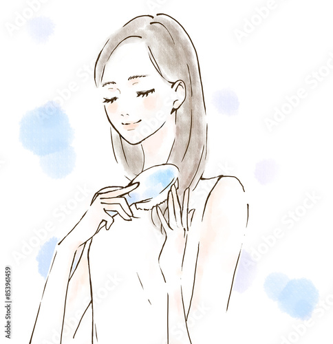 ブラシで髪をとかす笑顔の女性　リラックス　頭皮ケア