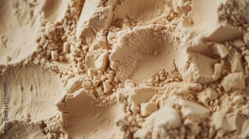 A realistic photograph of beige colored protein powder rippling.