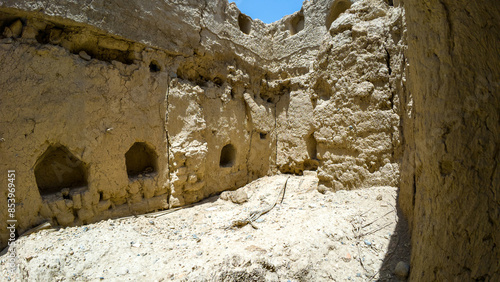 Photography of old abandoned adobe village near Nizwah in Oman during spring day photo