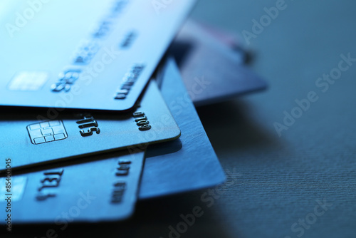 Many credit cards on dark background, closeup