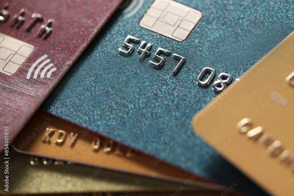 Different plastic credit cards as background, macro view Different plastic credit cards as background, macro view