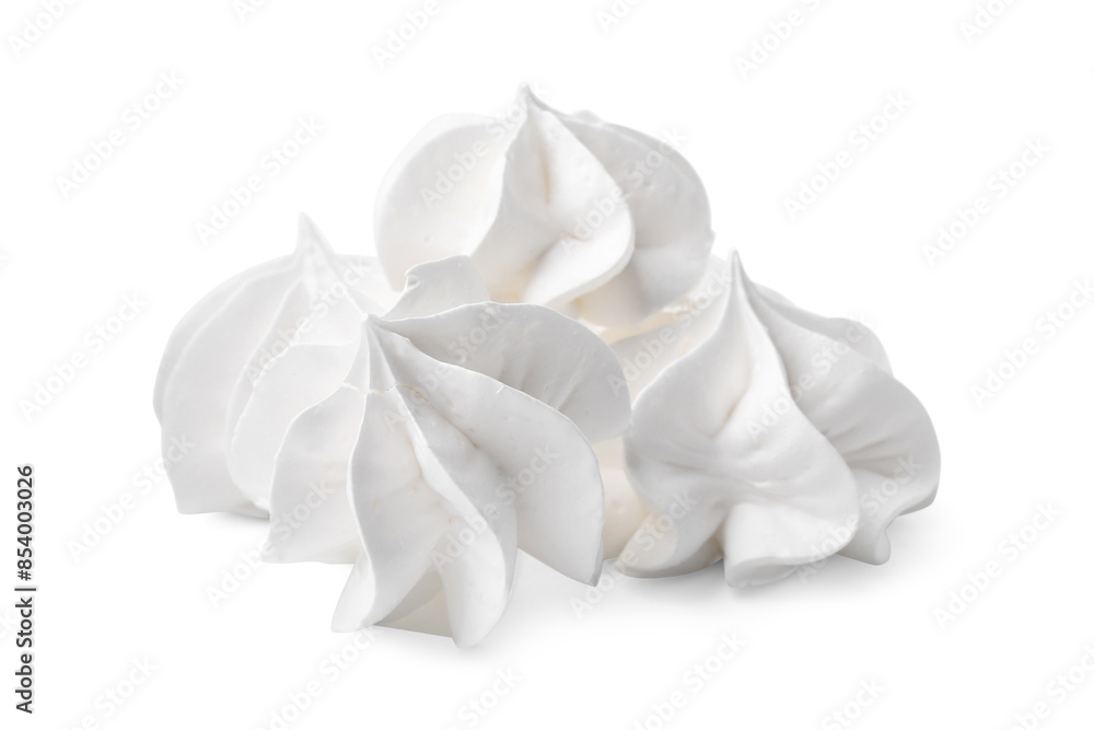 Many delicious meringue cookies isolated on white