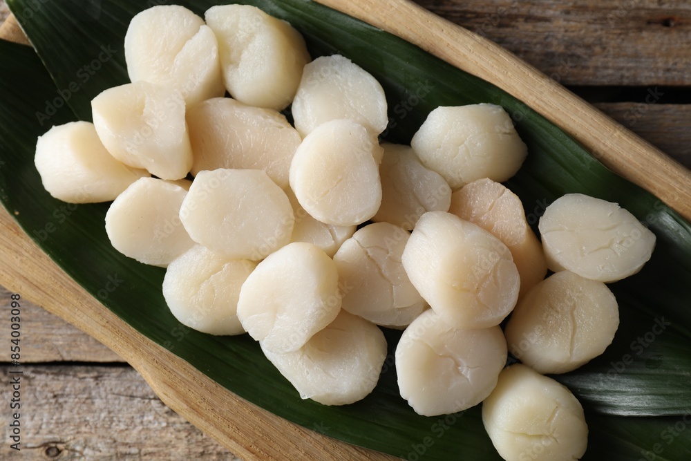 Fresh raw scallops on wooden table, top view Fresh raw scallops on wooden table, top view