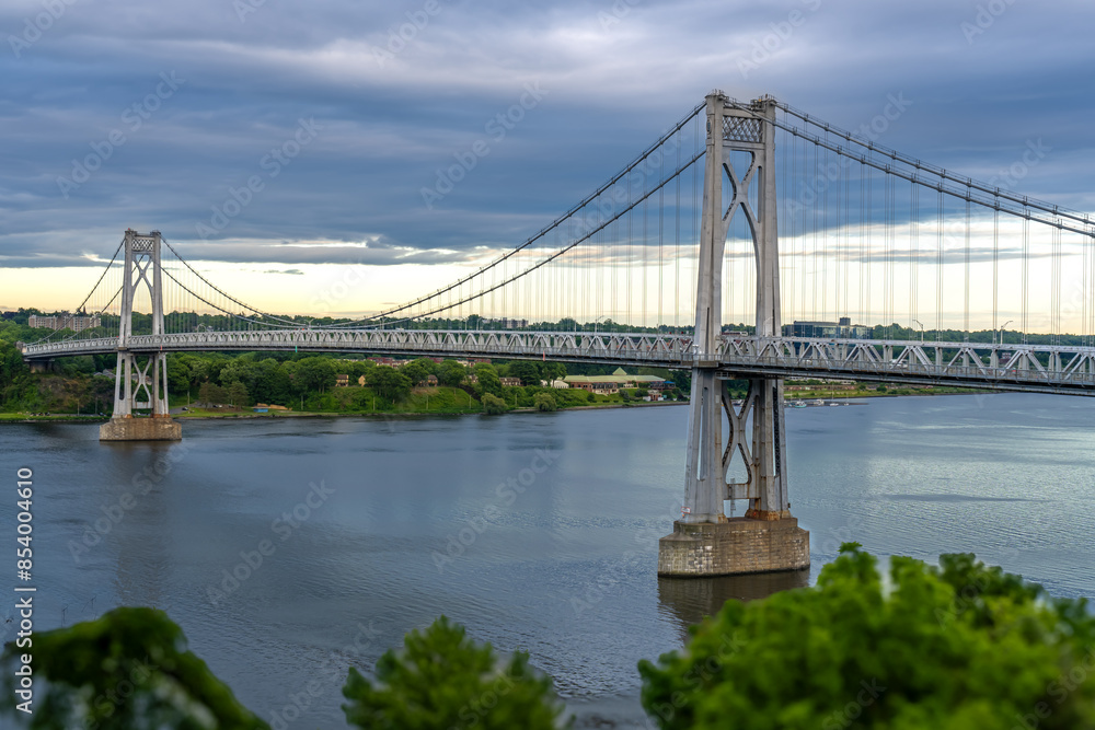 Fototapeta premium Aerial photo of the Franklin Delano Roosevelt Mid-Hudson Bridge over the Hudson River, Poughkeepsie NY. 