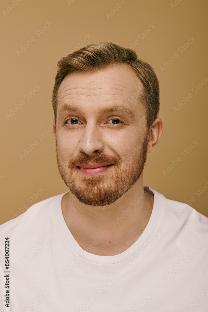 A stylish man with a beard wears a white t-shirt, embodying the essence of the outdoors. A stylish man with a beard wears a white t-shirt, embodying the essence of the outdoors.