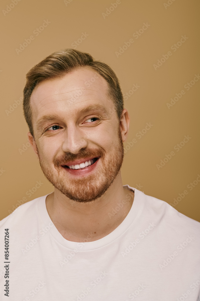 Stylish man with a beard smiling for the camera. Stylish man with a beard smiling for the camera.