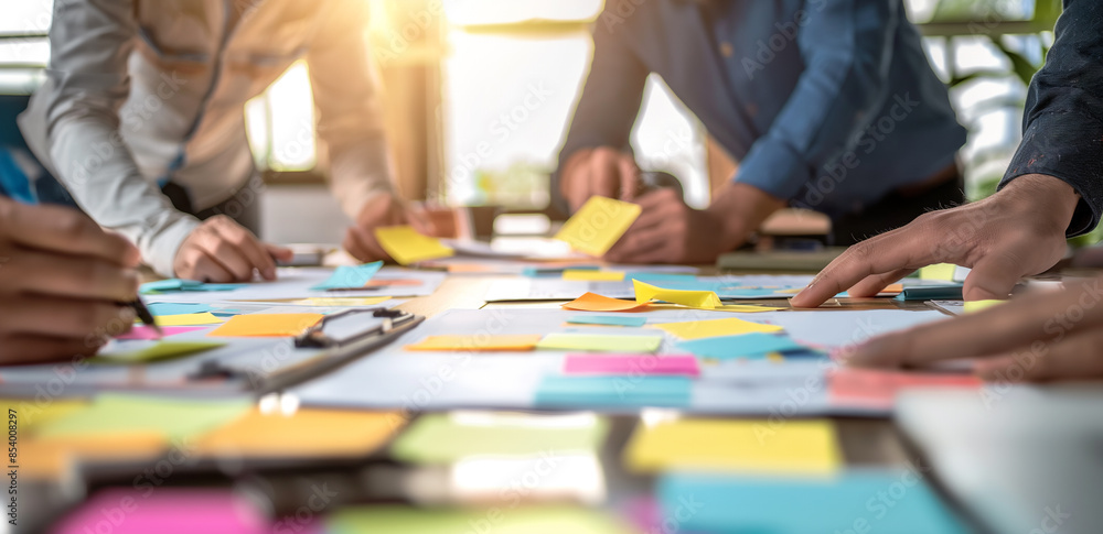 Fototapeta premium Team Collaboration with Sticky Notes in Office 
