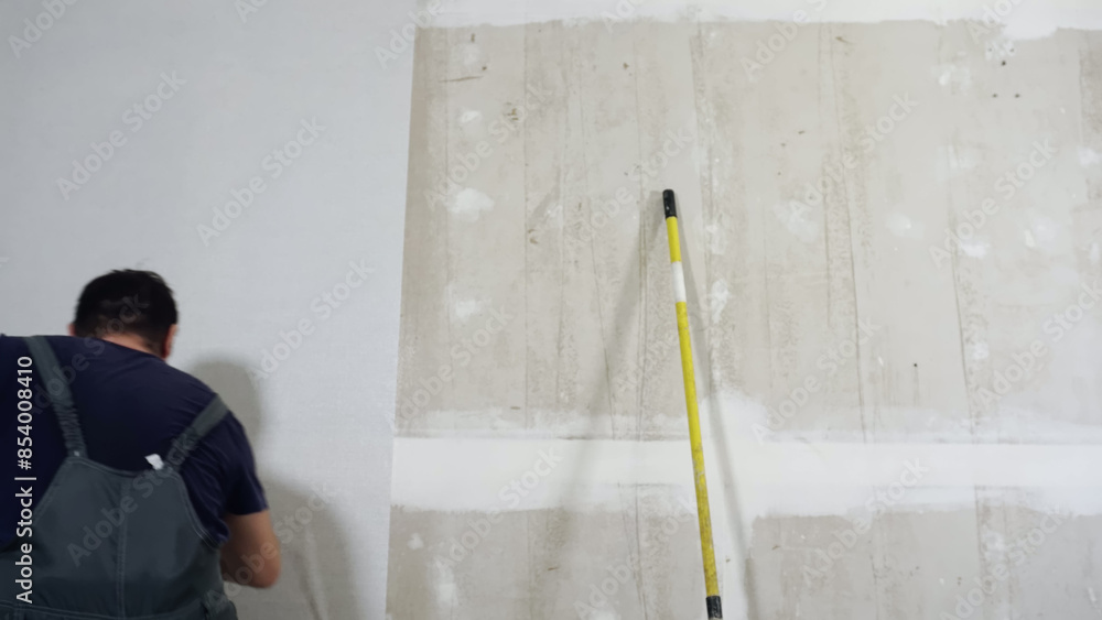 Time lapse of wallpapering in the room. Time lapse of wallpapering in the room.