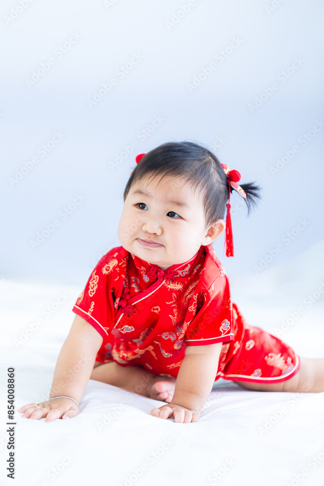 Girl in Chinese New Year costume,Happy Little asian girl in chinese traditional dress laughing and smiling. Girl in Chinese New Year costume,Happy Little asian girl in chinese traditional dress laughing and smiling.