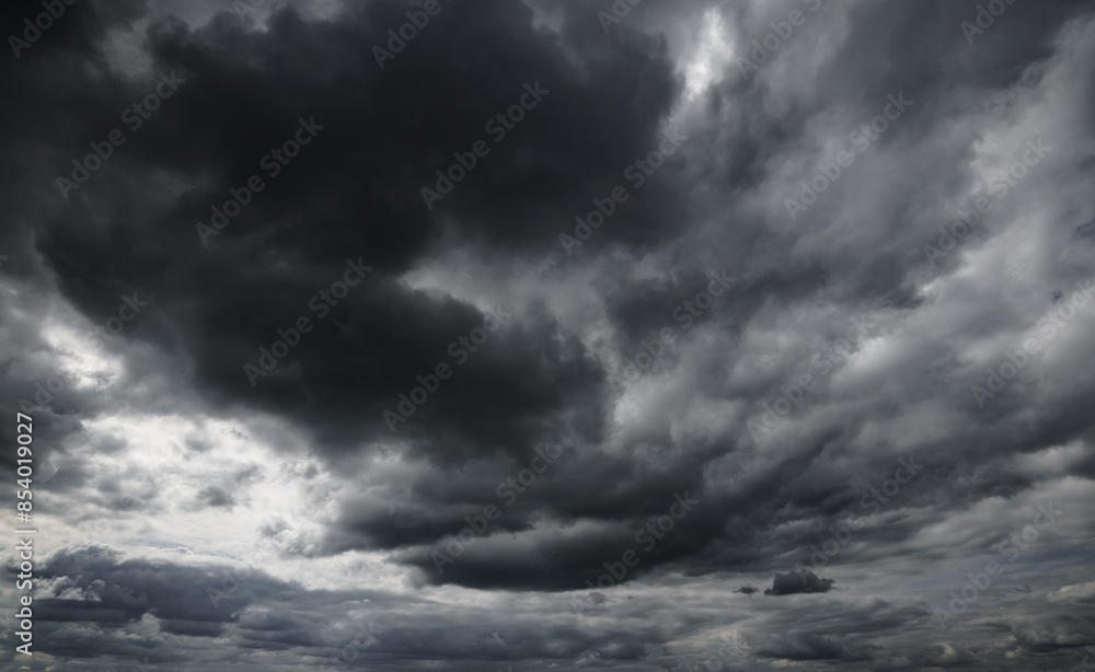 dark dramatic sky with black stormy clouds before rain as abstract background, extreme weather dark dramatic sky with black stormy clouds before rain as abstract background, extreme weather