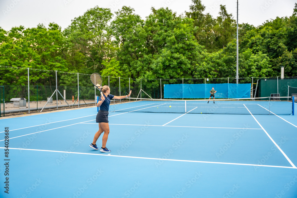 Obraz premium Professional tennis players playing the tennis on outside court