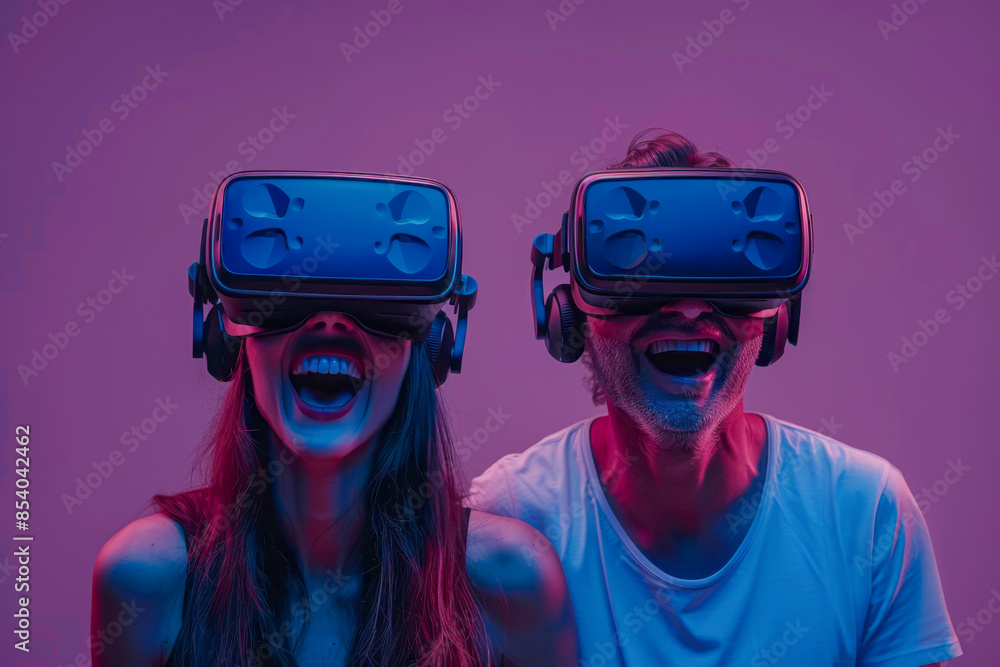 Joyful couple enjoying virtual reality experience together. Cutting-edge technology brings friends closer. Dive into the future of fun! Joyful couple enjoying virtual reality experience together. Cutting-edge technology brings friends closer. Dive into the future of fun!