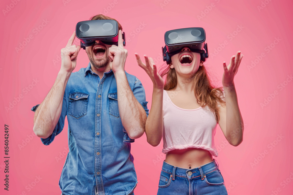 Excited Couple Enjoying Virtual Reality Glasses Together. Futuristic Technology Fun Friends Experience. Excited Couple Enjoying Virtual Reality Glasses Together. Futuristic Technology Fun Friends Experience.