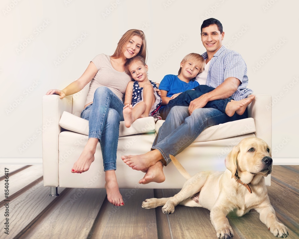 Smiling beautiful happy family with children and dog relaxing together Smiling beautiful happy family with children and dog relaxing together