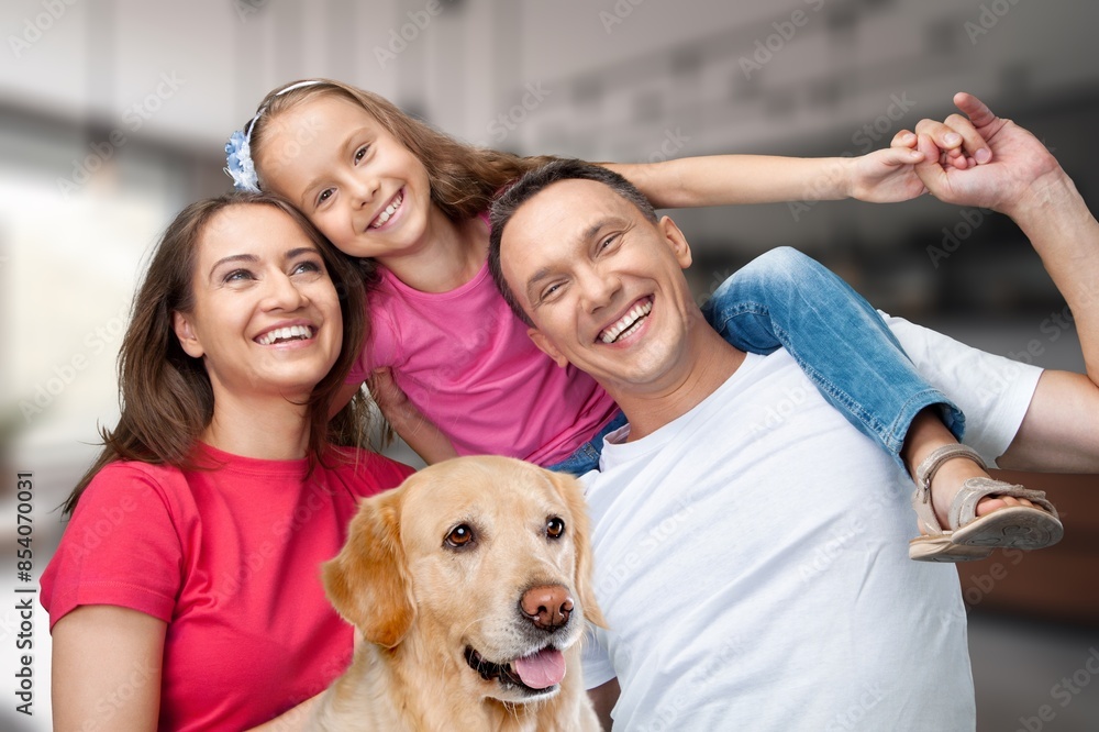 Smiling beautiful happy family with children and dog relaxing together Smiling beautiful happy family with children and dog relaxing together