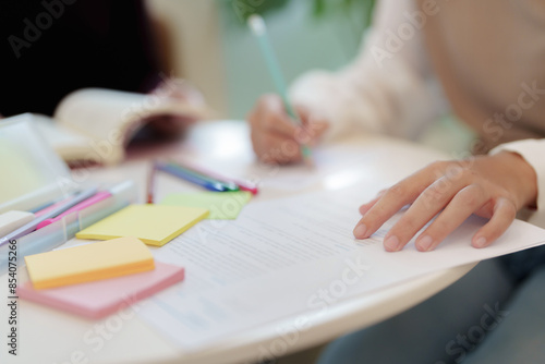 Two Asian college students meeting brainstorming in research university project.