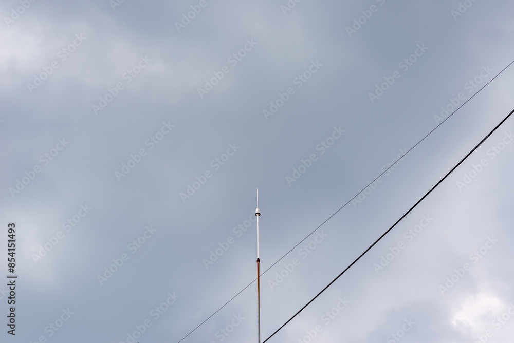 Lightning rod against stormy sky on a rainy day Lightning rod against stormy sky on a rainy day