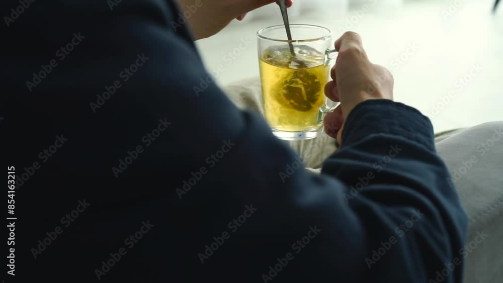 Green tea in a transparent cup.
A man stirs tea with a teaspoon.
Hot tea with takane Green tea in a transparent cup.
A man stirs tea with a teaspoon.
Hot tea with takane