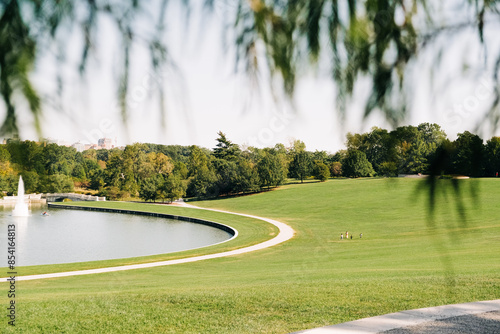 Wallpaper Mural A Sunny Day at Forest Park With a Scenic View of a Fountain and Lake Torontodigital.ca