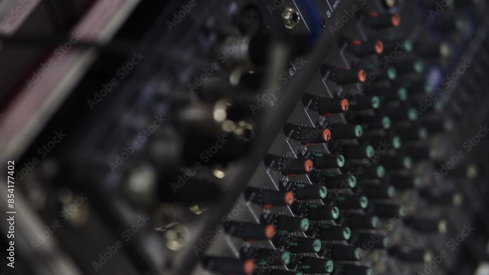 sound engineer console close-up. Electric machine on the table for the work of a sound designer or club dj at a nightclub party. Professional tool sound engineer in the studio or at a concert.