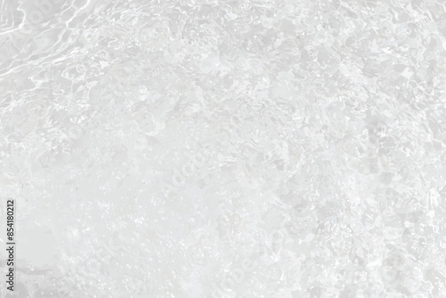 White water with ripples on the surface. Defocus blurred transparent white colored clear calm water surface texture with splashes and bubbles. Water waves with shining pattern texture background.