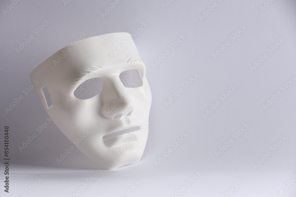 Plastic face mask on white background, space for text. Theatrical performance Plastic face mask on white background, space for text. Theatrical performance