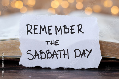 Bild auf Leinwand Remember the Sabbath Day, handwritten quote with holy bible book and bokeh light background