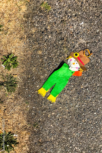 old rag doll on the asphalt