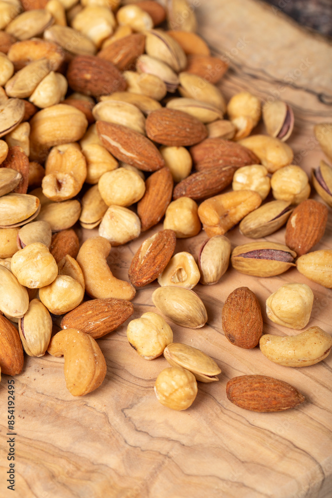 Mixed nuts on wooden background. Close up Mixed nuts on wooden background. Close up