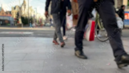 Wallpaper Mural The city street is filled with a bustling crowd of people, strolling and lugging shopping bags Torontodigital.ca