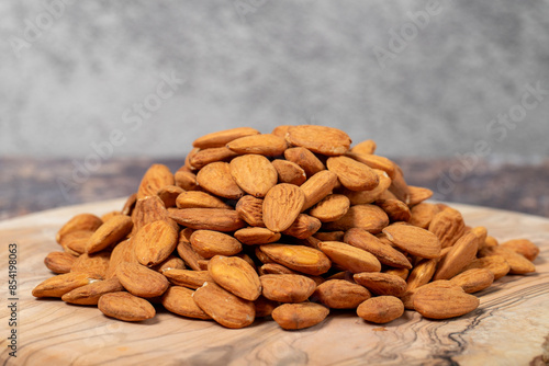 Wallpaper Mural Pile of almonds on wood background. Close up Torontodigital.ca