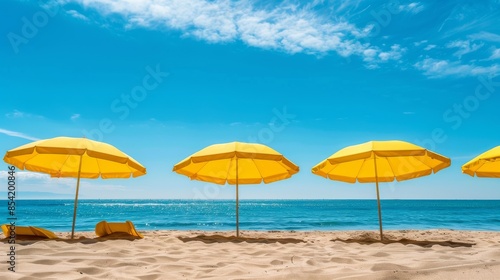 Yellow beach umbrellas on a sunny day. Bright colored umbrellas on the beach © Nicat