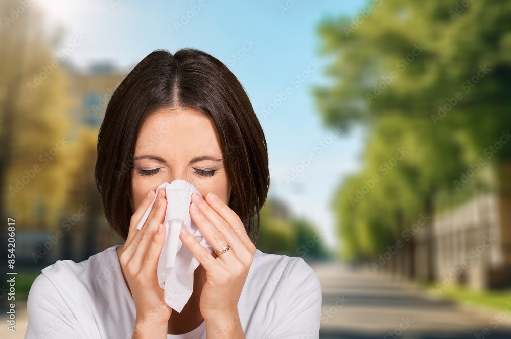 Young woman has blowing nose hold tissue paper Young woman has blowing nose hold tissue paper