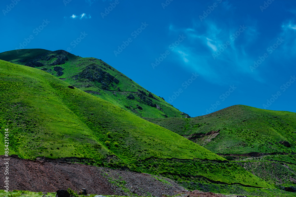 Green mountains on blue sky background in summer Green mountains on blue sky background in summer