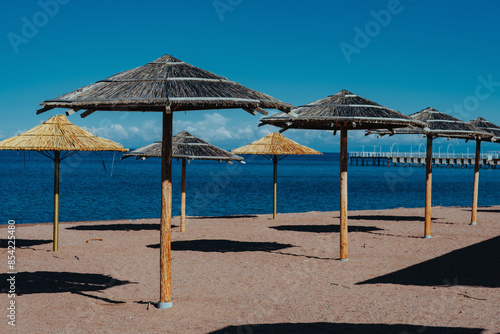 Umbrellas on sea beach on summer day