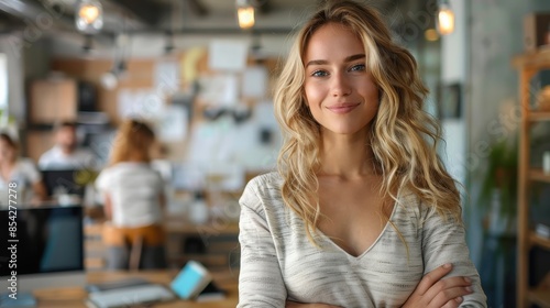 A radiant woman smiling in a bustling coworking office environment, showcasing contemporary office culture