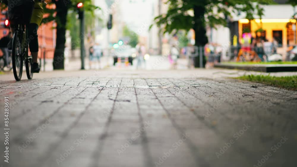 Indulge in a relaxed bike ride through a vibrant city, gliding along cobblestone streets in a peaceful, slow pace Indulge in a relaxed bike ride through a vibrant city, gliding along cobblestone streets in a peaceful, slow pace
